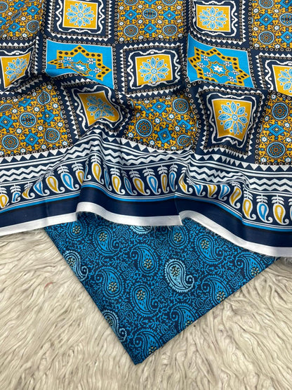 Two pieces of patterned fabric on a textured surface