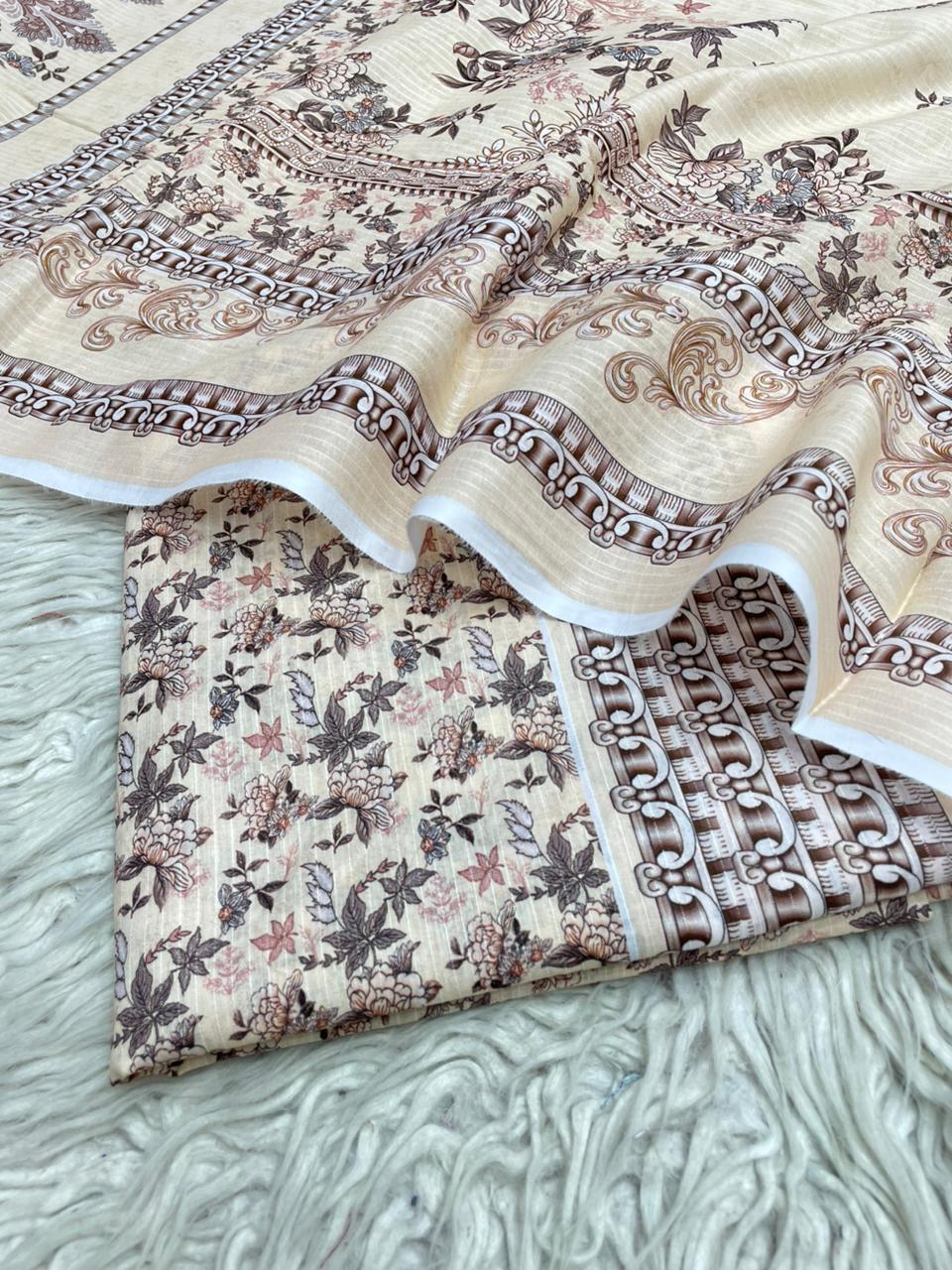 Two pieces of patterned fabric on a textured surface