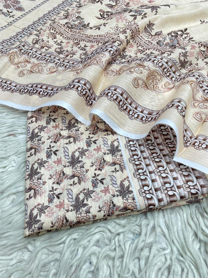 Two pieces of patterned fabric on a textured surface